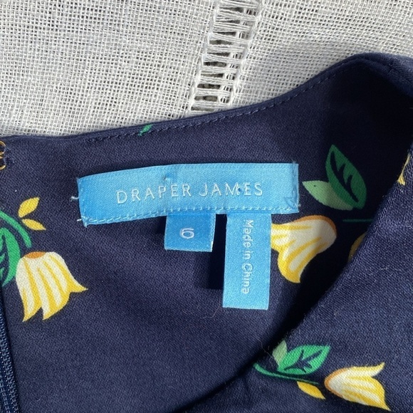 Draper James navy floral sleeveless dress with ruffled hem. - Picture 2 of 12